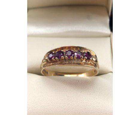 9ct Gold ring set with five Amethyst on claw settings