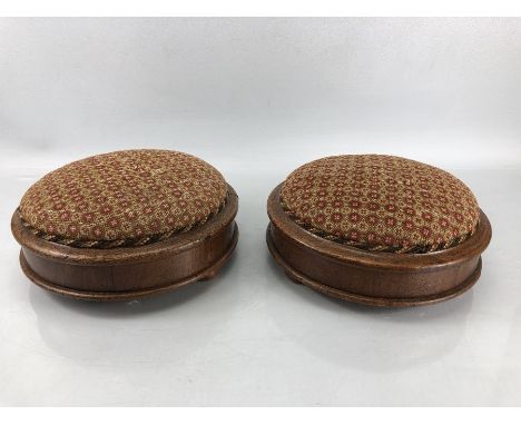Pair of Victorian foot stools, each with tapestry padded top, on bun feet, approx 26cm in diameter