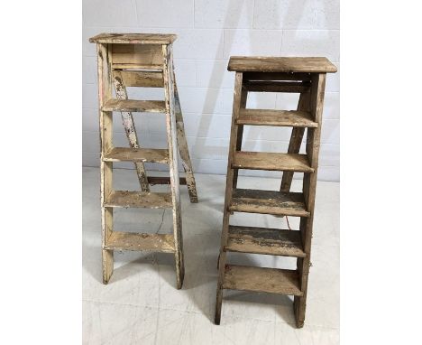 Two sets of vintage wooden step ladders, the tallest approx 130cm in height
