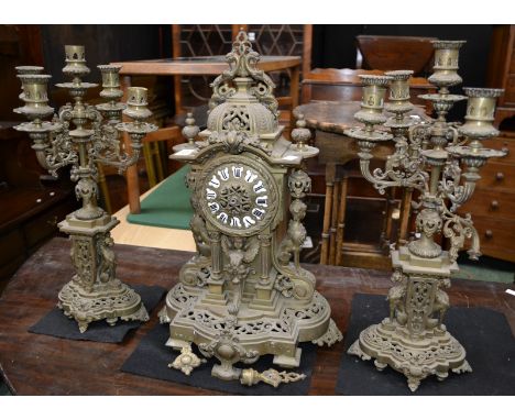 A Japy Freres brass clock garniture in the Empire taste, the clock with domed pediment and urnular finials, sphinx caryatids,