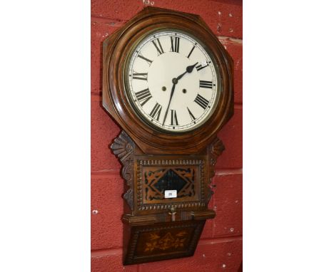 An Anglo American carved and inlaid oak drop dial wall clock, white dial, Roman numerals, 