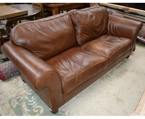 A Laura Ashley brown leather two seat sofa.