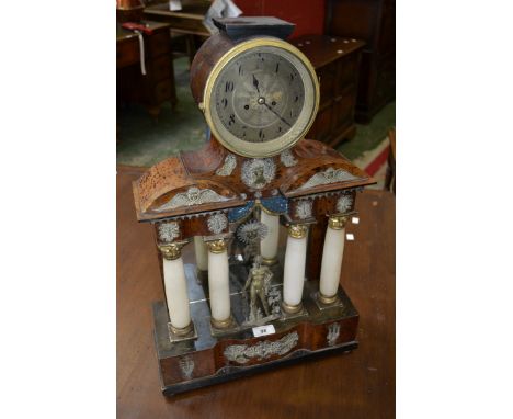 A late 19th century archaising walnut veneer and gilt metal mantel clock, the drum case raised on an elaborate  veneered pine