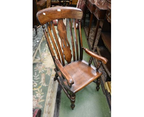 A Victorian beech comb back Windsor elbow chair, c.1880