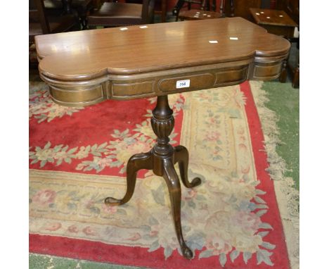 A reproduction mahogany card table, serpentine fold over top enclosing green baize playing surface, turned and lobed baluster