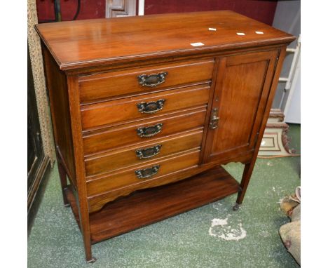 An Edwardian mahogany music cabinet, moulded rectangular top, five fall front drawers, adjacent panelled door cupboard, shape