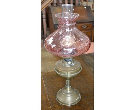 A Victorian oil lamp, with Cranberry shade