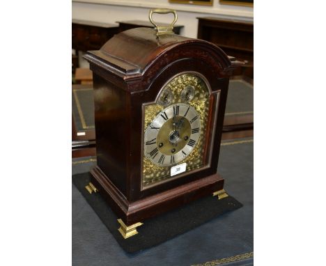 An early 20th century mahogany musical bracket clock, arched brass dial with silvered chapter ring, Chime/Silent and regulato