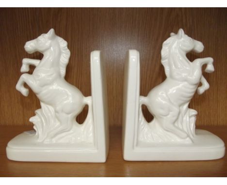 Pair of ceramic blanc de chine bookends in the form of horsers
