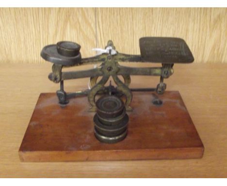 Set of early brass postal scales and weights