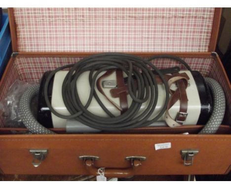Cased vintage vacuum cleaner 