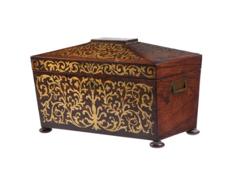 Y A rosewood and brass inlaid tea caddy, circa 1820, of sarcophagus form, the with two internal subsidiary canisters and aper