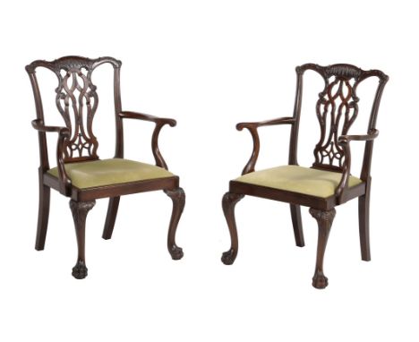 A pair of mahogany open arm chairs in George III style, second half 20th century, after the manner of designs by Thomas Chipp