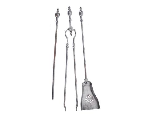 A set of Victorian steel fire tools, second half 19th century, comprising shovel, poker and tongs, each cast with a faceted g