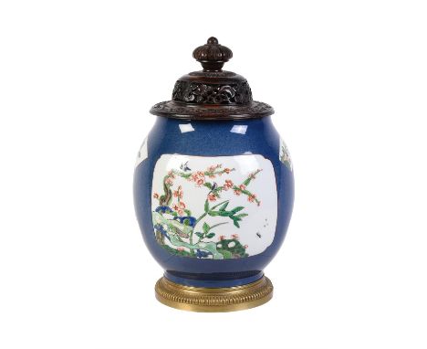 An Edme Samson powder-blue ground and gilt-metal mounted ovoid vase in the famille verte style and associated carved wood cov