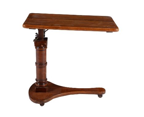 A Victorian walnut adjustable reading stand, circa 1870, the angle and height adjustable rest above stem and shaped triform b