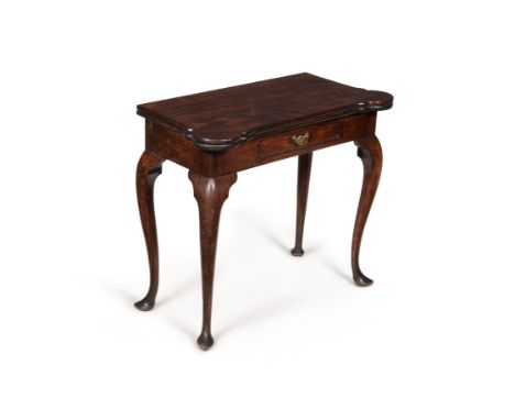 A George II mahogany card table, circa 1740, with rounded castelated corners, the top opening to a baize playing surface and 