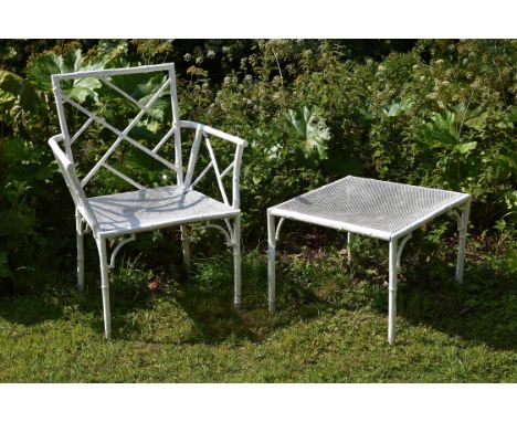 A white painted metal garden armchair in Chinese Chippendale style, 20th century; 91cm high, 71cm wide; and a low table en su