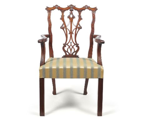 A George III mahogany open armchair, late 18th century, in Chinese Chippendale manner, the back with pierced vertical splat a