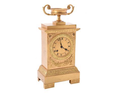 A French gilt metal mantel clock in Empire style, circa 1900, the eight-day bell striking movement with silk suspension and o