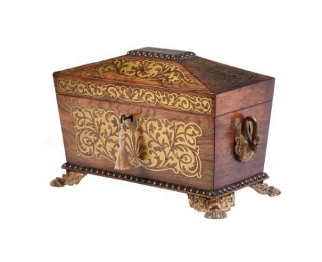Y A Regency rosewood and brass marquetry inlaid tea caddy, circa 1815, of beaded and sarcophagus form the lid enclosing a pai