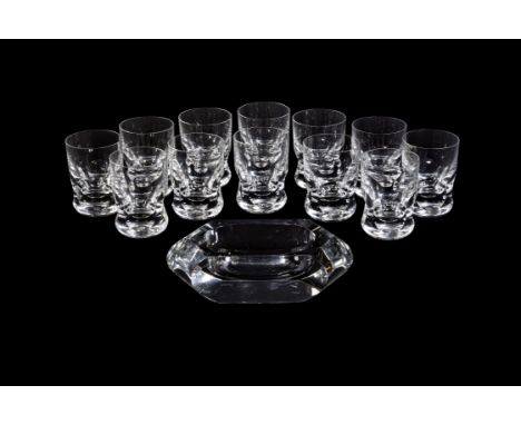 Baccarat, Eve Harcourt, a set of twelve cut and moulded glass tumblers, engraved marks, 11.5cm high; together with a Baccarat