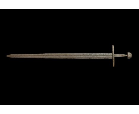 10th-12th century AD. A Viking or Norman Sword with a fine double-edged tapered blade, still retaining well-defined cutting e