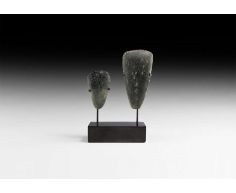 Neolithic, 6th-3rd millennium BC. A pair of polished diorite axeheads; mounted on a custom-made display stand.   460 grams to