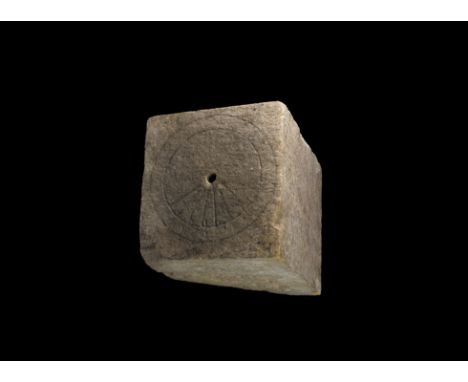 13th-14th century AD. A corbel or plinth element with chamfered underside, keyed surfaces, upper face with concentric rings a