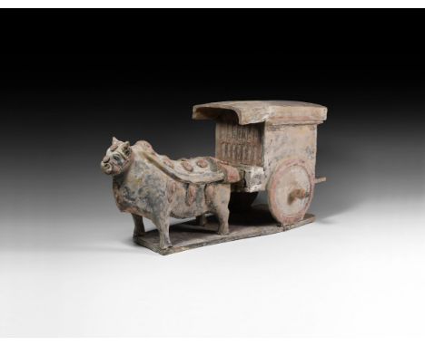 Han Dynasty, 206 BC-220 AD. A ceramic model carriage comprising: cuboid body with two large wheels, overhanging roof canopy, 