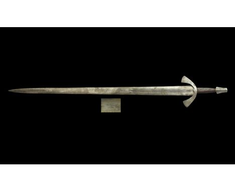 Circa 1075-1155 AD. An original Viking iron blade of Oakeshott's Type XII, variant 12 (Oakeshott, 1991, p.81), reused with Ty