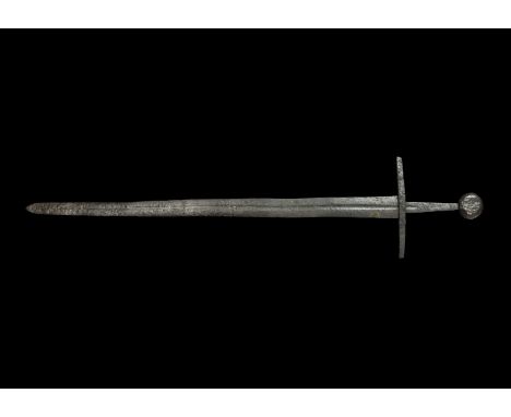 12th century AD. An iron sword with two-edged blade, gently tapering profile with shallow tip, shallow fuller, parallel-sided