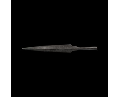 9th century AD. A hand-forged iron spearhead of Petersen's Type K with tapering lentoid-section blade, rounded tip, stepped s