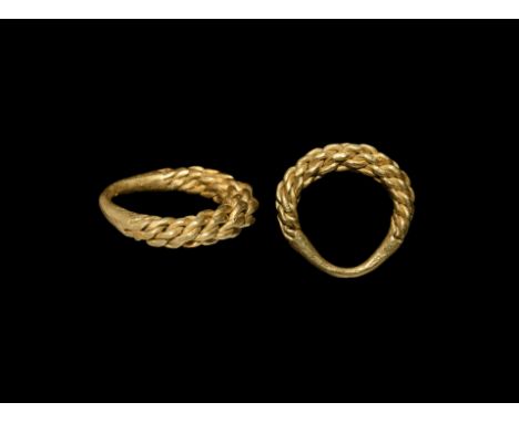 9th-10th century AD. A finger ring of tightly braided gold wire tapering to the ends and fused to the underside.   12.6 grams