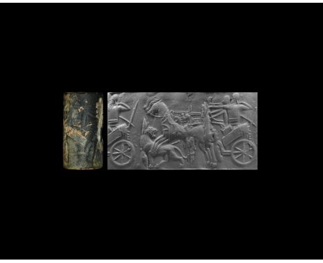 9th-7th century BC. A large bituminous limestone cylinder seal with hunting scene, comprising from right to left: the Neo-Ass
