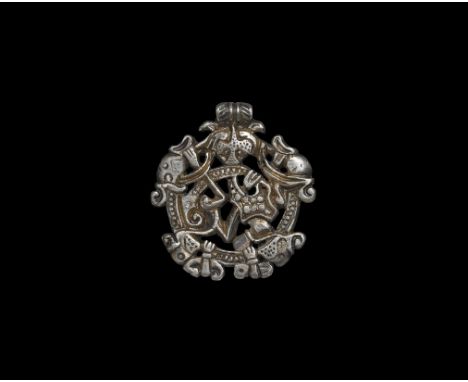 10th-11th century AD. A silver-gilt pendant with Borre-style beast and integral suspension loop with herringbone detailing; t