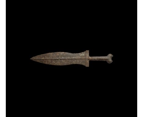 1st-2nd century AD. An iron pugio military dagger with waisted leaf-shaped blade, rounded midrib, rectangular riveted baluste