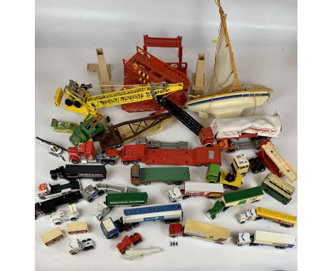 Assorted loose trucks, cranes and model boat