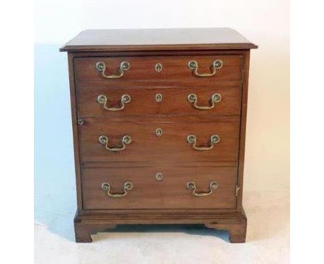 A mahogany Georgian-style pot cupboard, the cupboard door having a bank of dummy drawers over bracket feet, h. 70 cm, w. 61 c