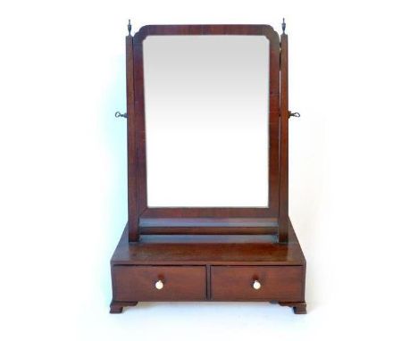 A Regency mahogany toilet mirror with two drawer base on ogee bracket feet, l. 65 cm, w. 45 cm, d. 20 cm CONDITION REPORT: Dr
