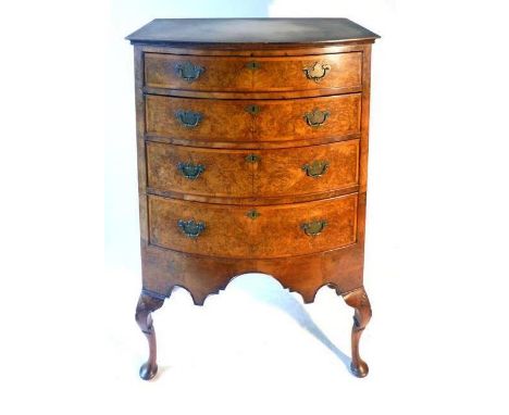 A 20th century burr walnut bow fronted chest of drawers, the book matched veneer, crossbanded and cavetto moulded top above f