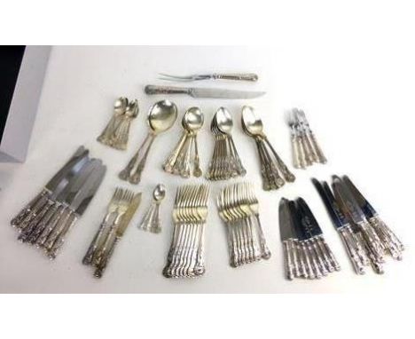 A collection of silver Kings patterned flatware including salad servers, soup spoons, dessert spoons and forks, table spoons 