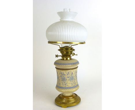 A Hinks of London Victorian oil lamp, the stoneware reservoir over a matching body on a brass base, h. 60 cm
