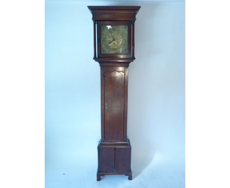 An 18th century oak longcase clock, the brass face having spandrels, pierced hands, date aperture and Roman numerals, the cas