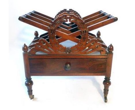 A Regency rosewood canterbury, in the manner of Gillows of Lancaster, the X-frame dividers separated by turned supports, with