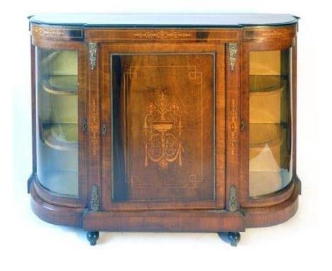 A Victorian walnut ebonised and inlaid credenza with brass mounts, the top over line inlaid and marquetry frieze above a cent