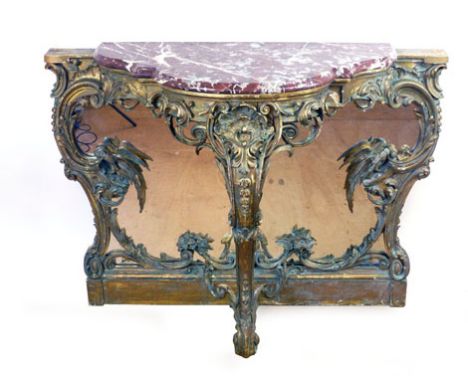 A 19th century Italian giltwood rococo console table, the marble top on a mirrored back and a carved foliate, bird and scroll