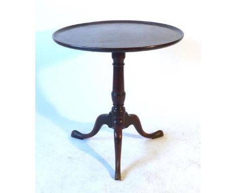 A Georgian mahogany tilt top tripod table, the dish top over a balustered turned column on a tripod base CONDITION REPORT: Wa