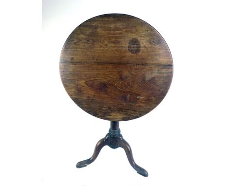 A George II mahogany tilt top tripod table, the top on a turned baluster column on three legs,  h. 72 cm, d. 75 cm CONDITION 