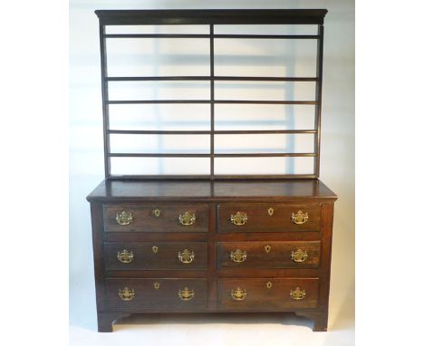 A Georgian-style oak dresser, the plate rack above the base with a bank of six drawers on bracket feet, l. 198 cm, w. 147 cm,